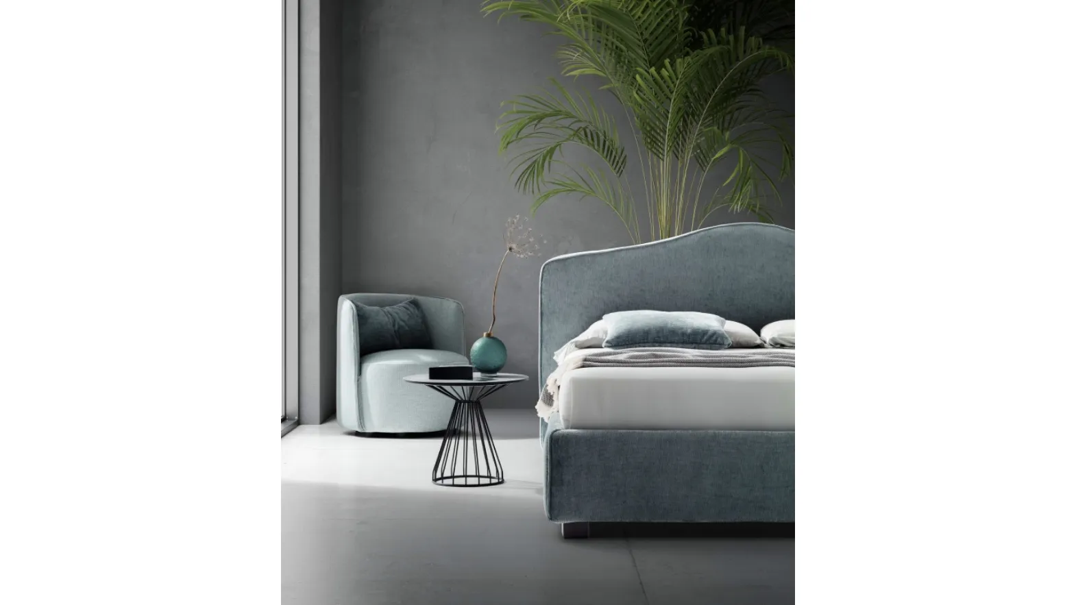 Upholstered bed with contoured headboard in Rose fabric by Le Comfort.