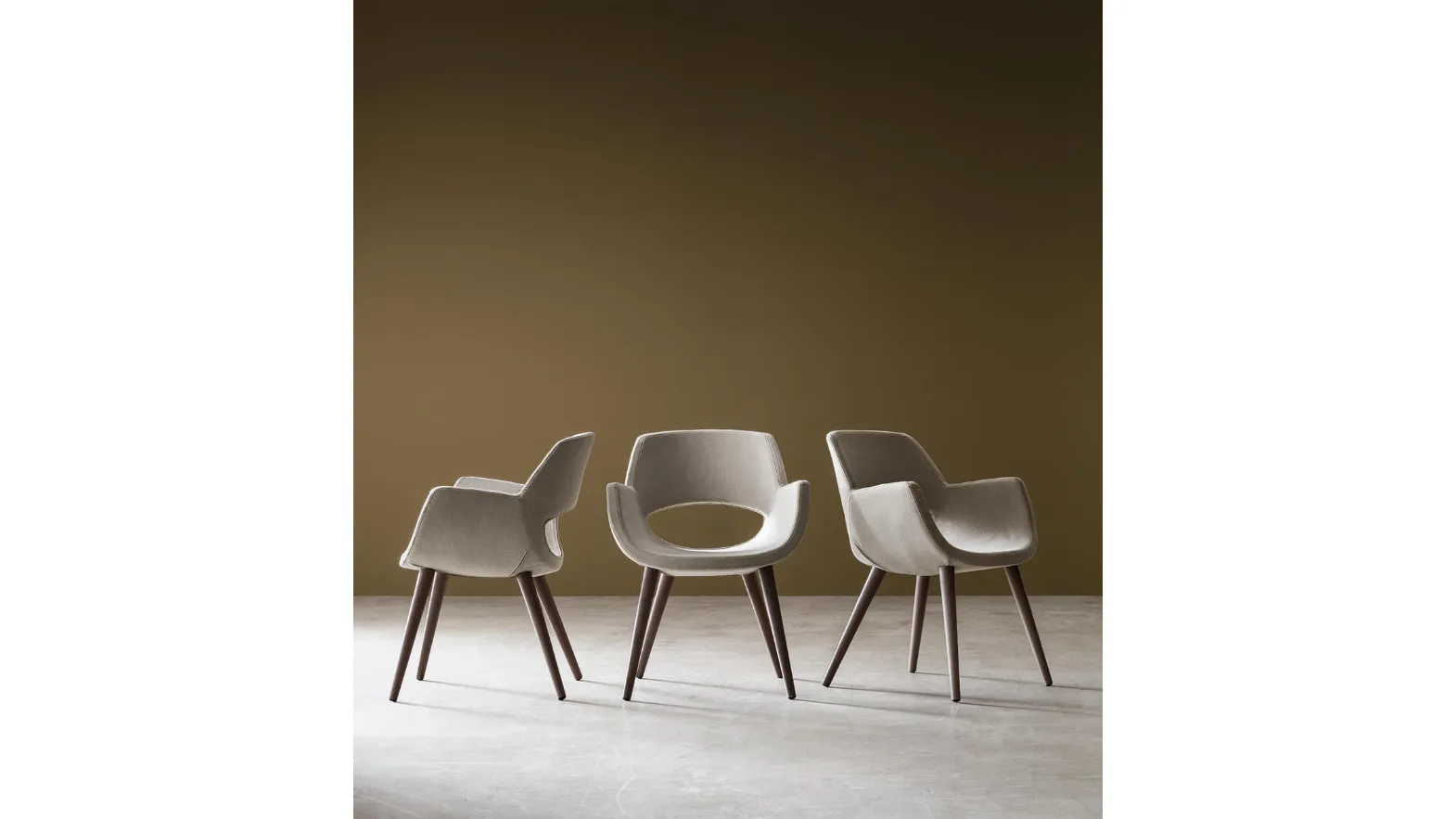 Logan upholstered chair in fabric by Maronese.