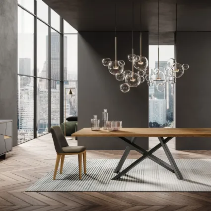 Nesty2 leather chair with wooden legs by FGF Mobili.