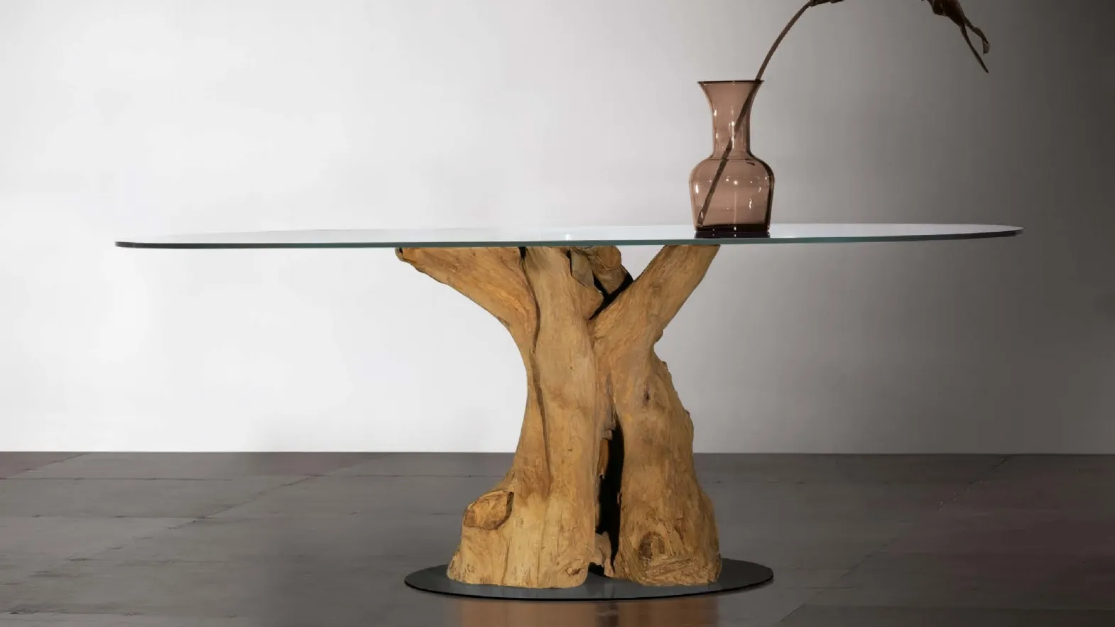Sequoia table with teak root base, transparent glass top, and metal base by Nature Design.