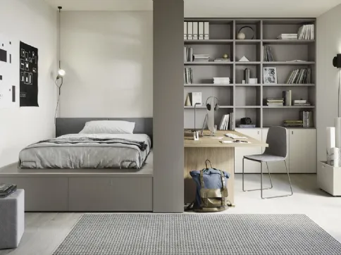 Bedroom with bed on chest of drawers and large Next space 02 bookcase by Nidi