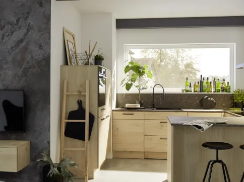 Custom-made corner kitchen with Artwood Nolte Oak peninsula